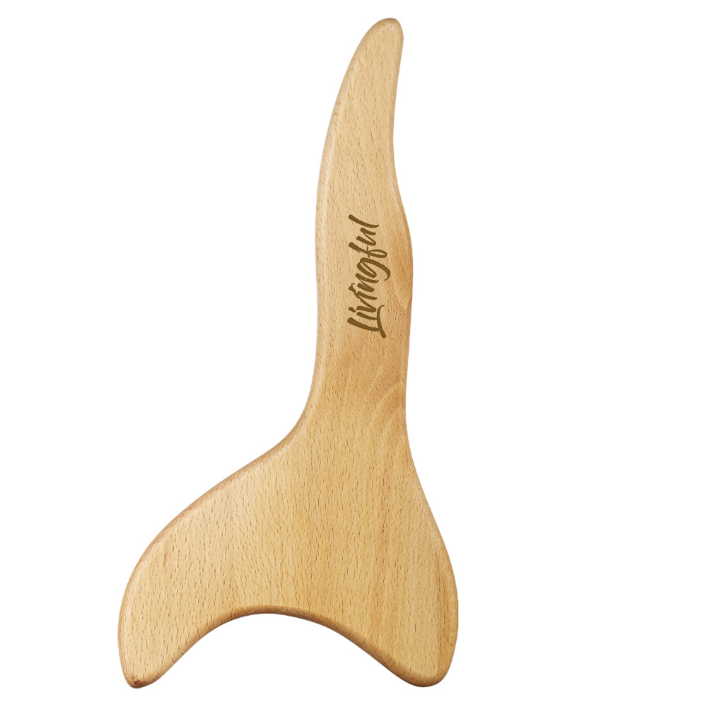 The Premium Wood Massage Tool 3 Sides, by Livingful, is expertly designed in the shape of a whale tail and is ideal for gua sha and lymphatic drainage. The tool features the brand name "Livingful" elegantly engraved on it.