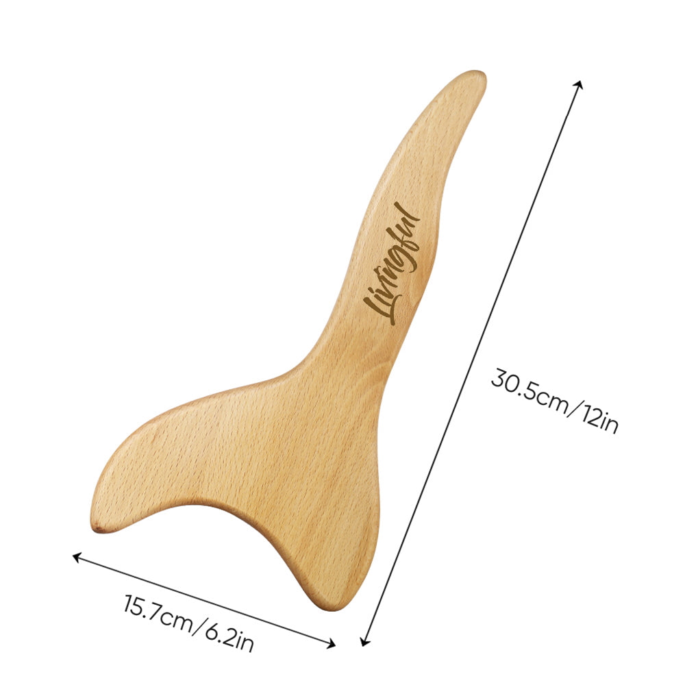 The Premium Wood Massage Tool 3 Sides by Livingful is a wooden tool designed for lymphatic drainage, crafted in the shape of a whale tail and measuring 30.5 cm by 15.7 cm.