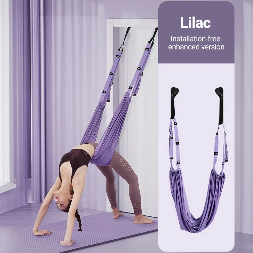 A person gracefully exercises with the ST Original's lilac Aerial Yoga Strap in the room, enhancing their yoga skills and stretching potential. The adjustable strap is perfect for deepening flexibility practices.