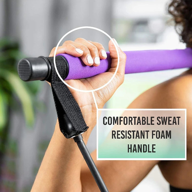 Close-up of a hand gripping the IPCBEC Multifunctional Pilates Bar, featuring a purple foam handle with an attached strap and adjustable buckle. Text reads: "Comfortable Sweat Resistant Foam Handle.