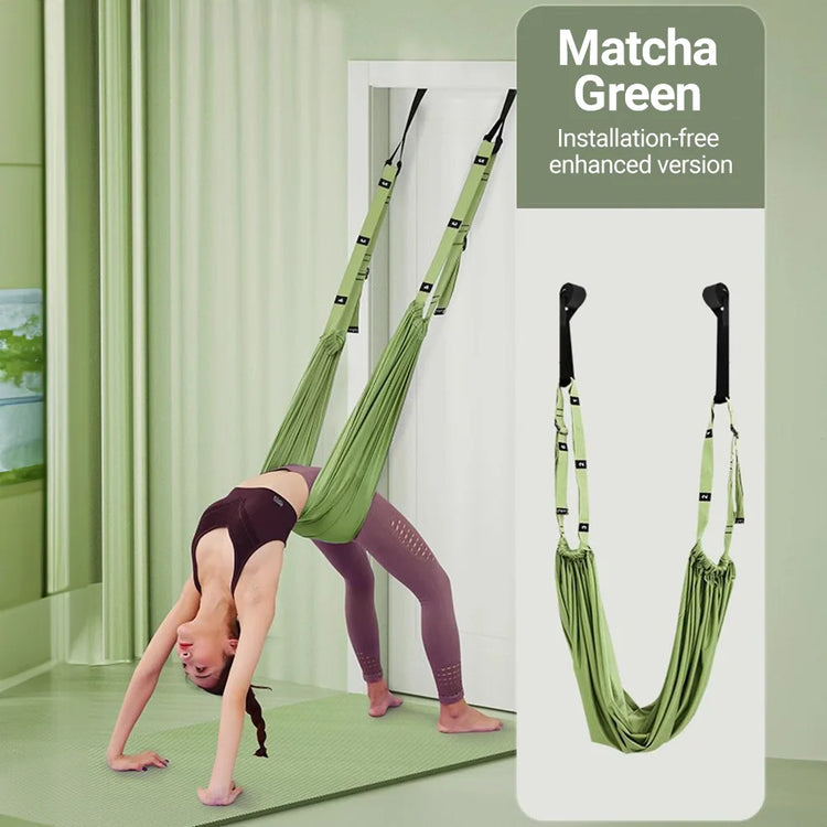 A person demonstrates their yoga abilities by performing a backbend with an adjustable Aerial Yoga Strap from ST Original, using a matcha green inversion swing in a room adorned with matching green decor.